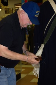 Even the contents of the pockets are authentic. Here the curator is retrieving the contents of the Revolutionary Way officer's pocket.