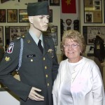 Betty Kelly Pelton with her brother's Vietnam War uniform.