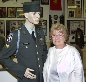 Betty Kelly Pelton with her brother's Vietnam War uniform.