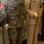 Current combat fatigues for Lance Corporal Sean Montgomery, USMC, currently serving in combat in Afghanistan. On the right are the summer service tans for Captain Jim Mcdonough, US Army, killed in Action in Vietnam on his second tour.