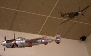 American P-38 with a British Spitfire in the background.