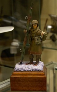 1/32 scale figure of a WWII US Army corpsman in combat at Bastogne during the Battle of the Bulge.
