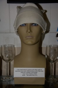 A hat, hand made in a prison cell using a pair of sweat socks by Col. Larry Chesley, US Air Force, POW 04-16-1966 to 02-12-1973.