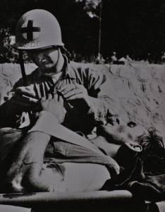 Coast Guard Corpsman giving aid at Normandy.