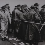Smiling German prisoners aboard a U.S. Coast Guard ship at Normandy.