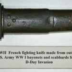 An improvised knife made from a WW I bayonet and scabbard.